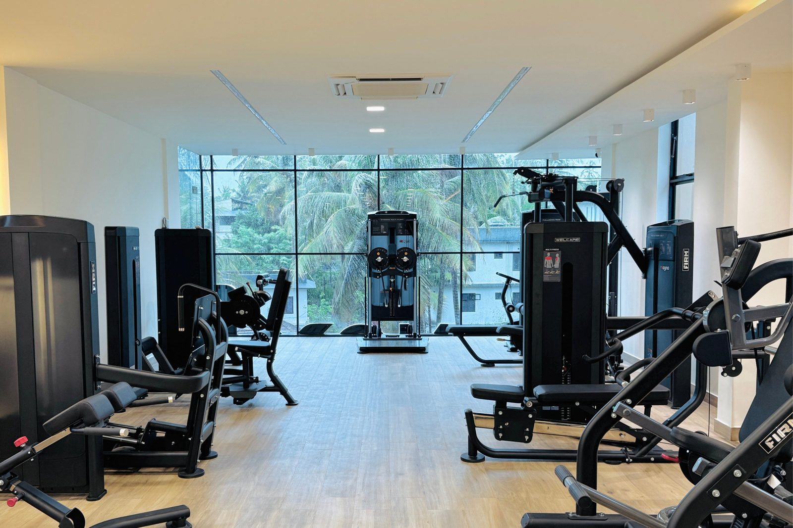 Strength floor — plate-loaded machines facing palm view